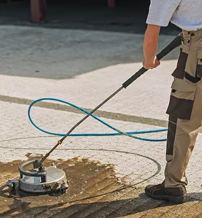cleaning the ground of a car park